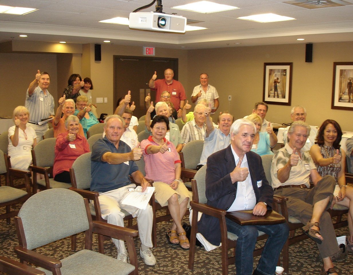 CARP event attendees showing thumbs up