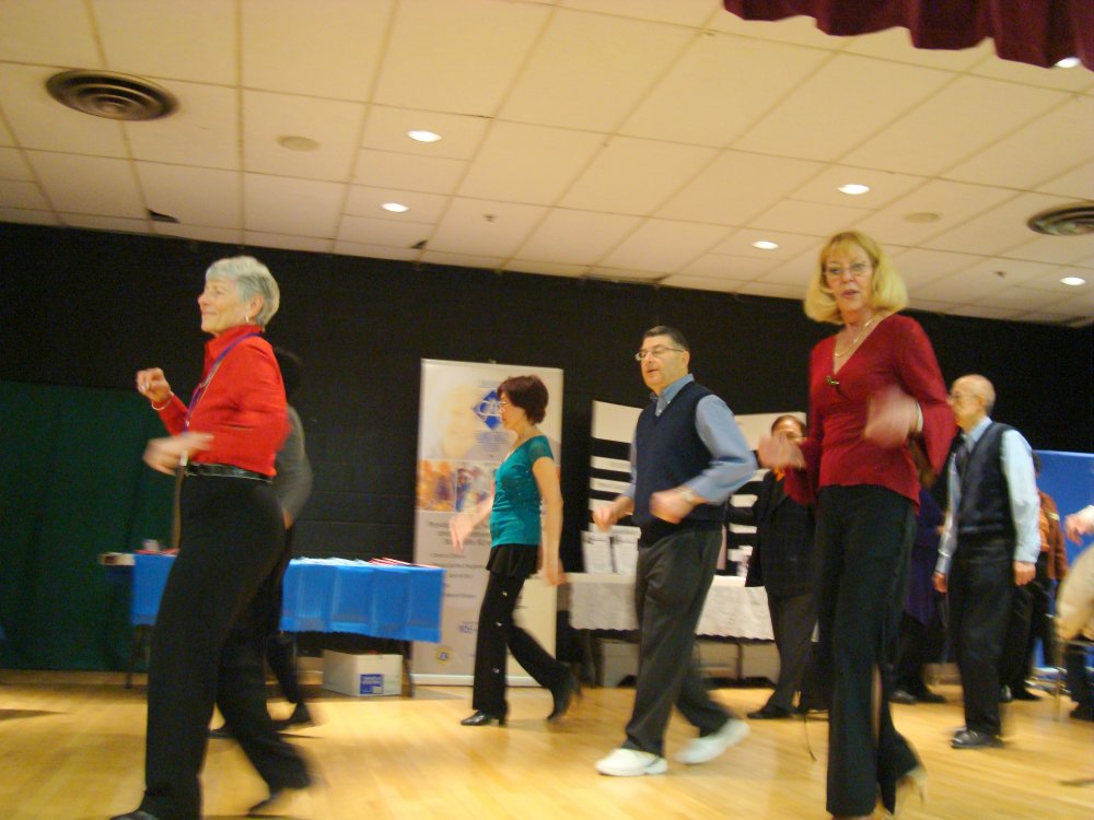 Merilyn leading Line Dance group on stage, Square One Older Adult Centre 26 March 2010