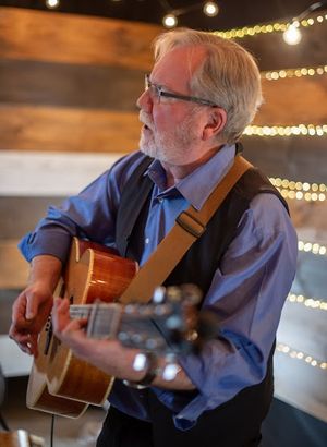 Bob MacLean Folksinger and Guitarist Google image from https://www.bobmaclean.ca/about-bob