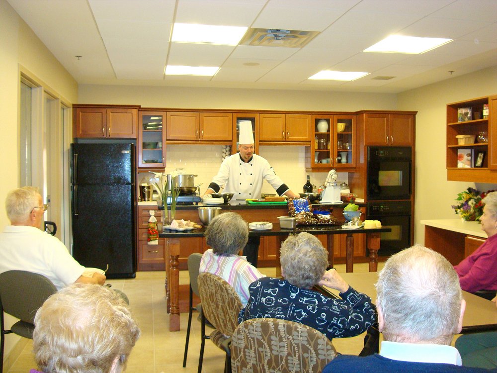 Chef Scott of Origin Evergreen Mississauga demonstrating and explaining to culinary class